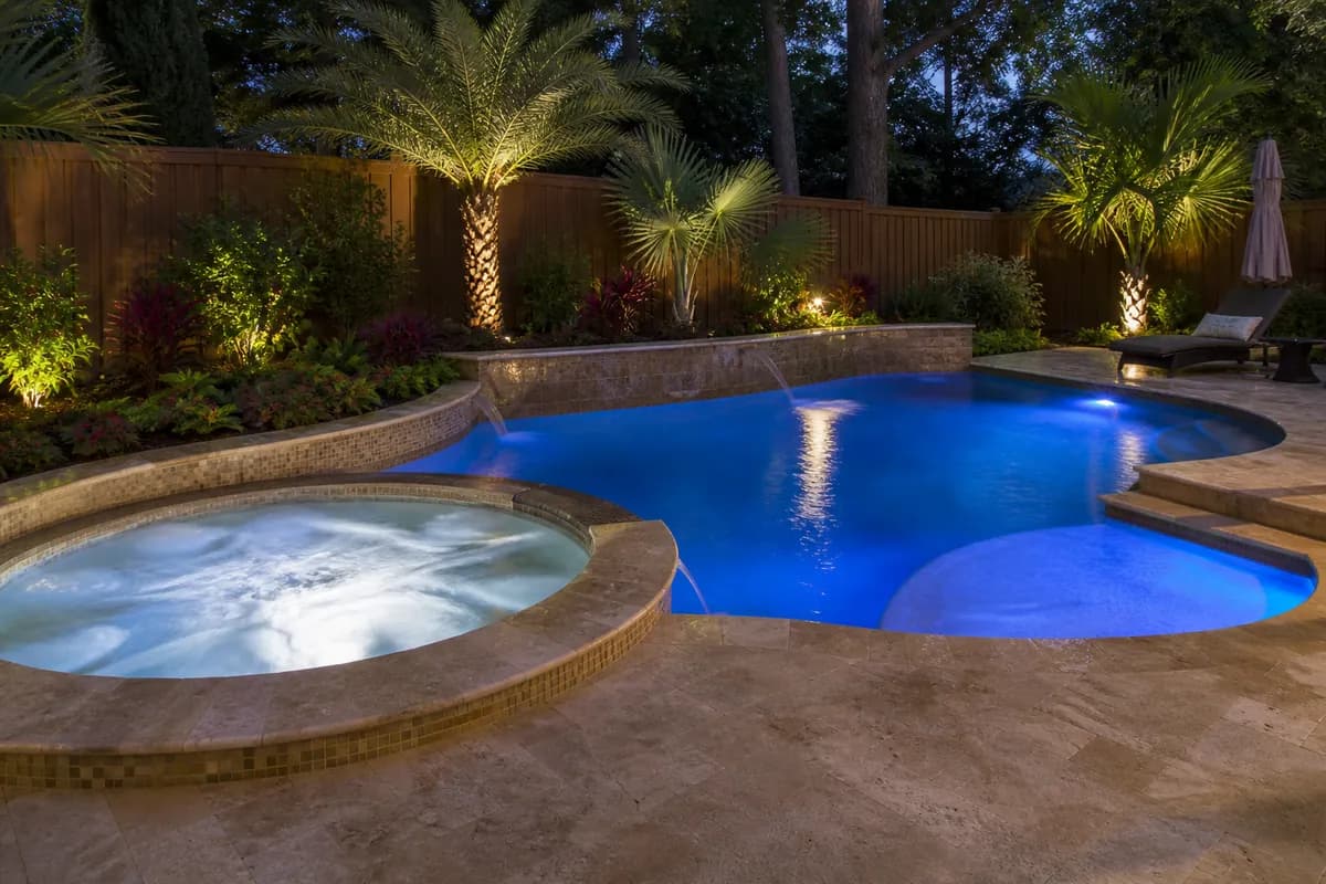 In-ground backyard swimming pool and spa